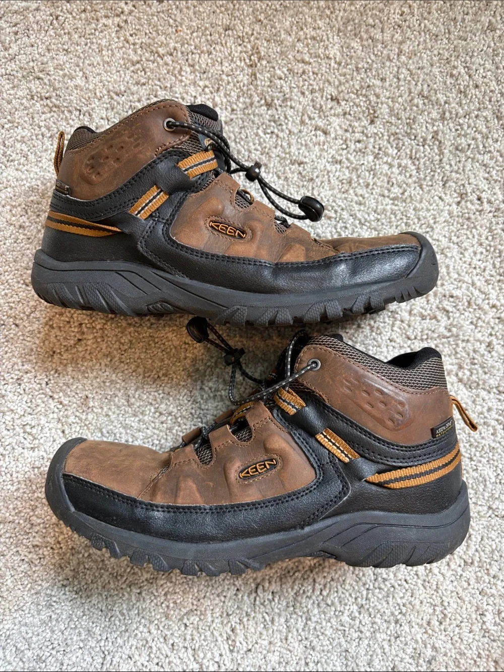 Keen Men's Brown and Black Trail Boots with Orange Accents